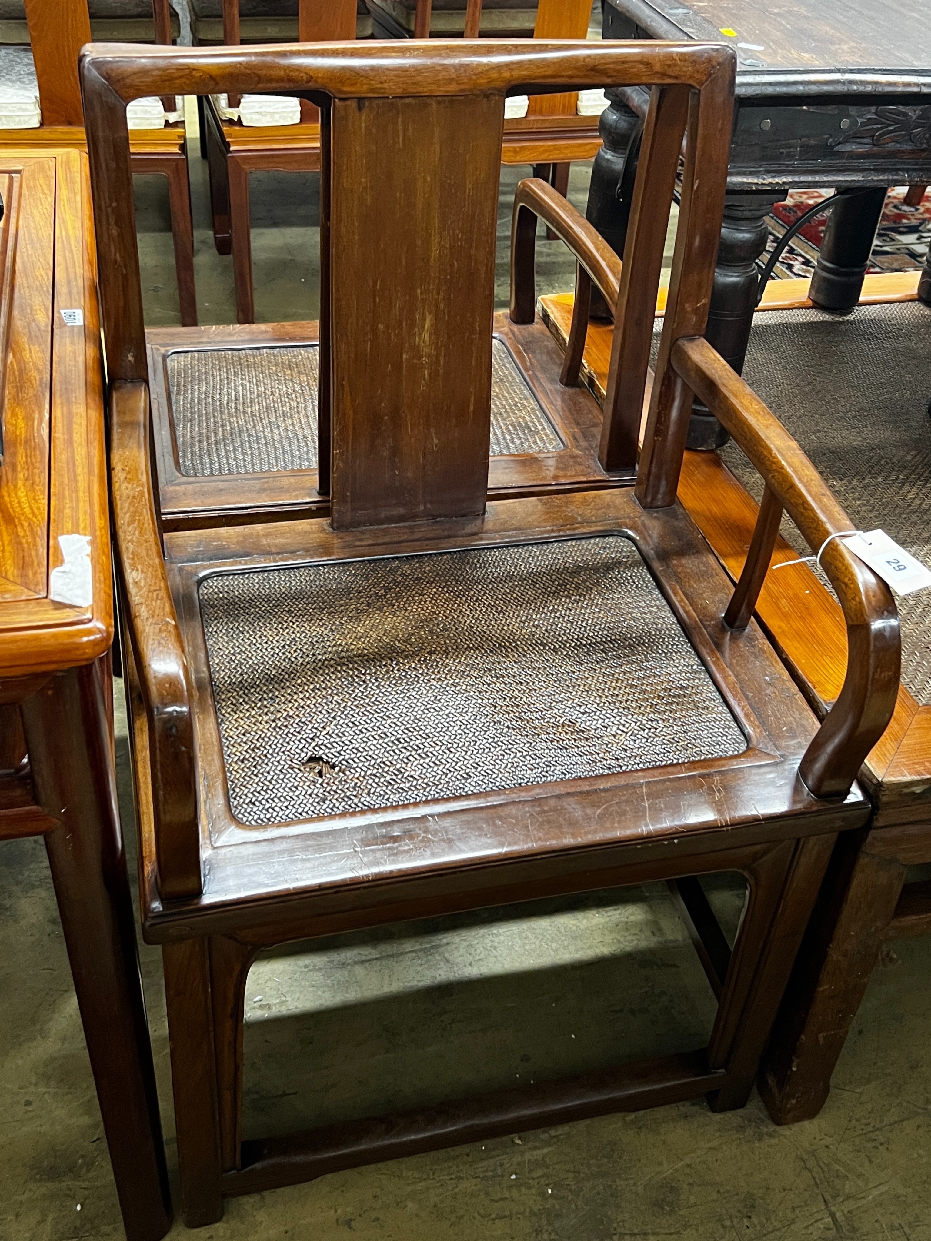 A pair of Chinese caned hardwood elbow chairs, width 55cm, depth 44cm, height 97cm